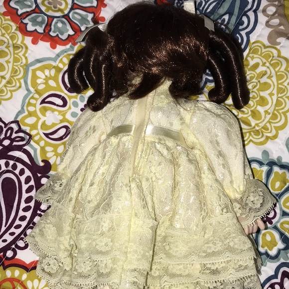 Elegant Cream Porcelain Doll with Brown Hair - Picture 4 of 7